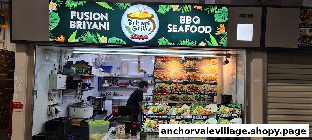 The storefront of Briyani Grill, featuring its signboard and a vibrant food display.