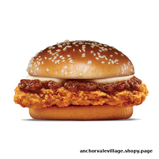 A close-up of a delicious chicken burger with a sesame bun, cheese, and savory sauce.