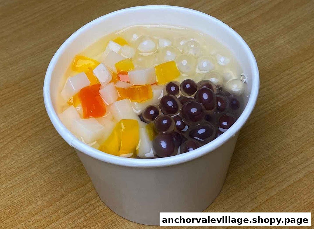 A close-up of a refreshing Dou Hua dessert with colorful toppings in a white cup.