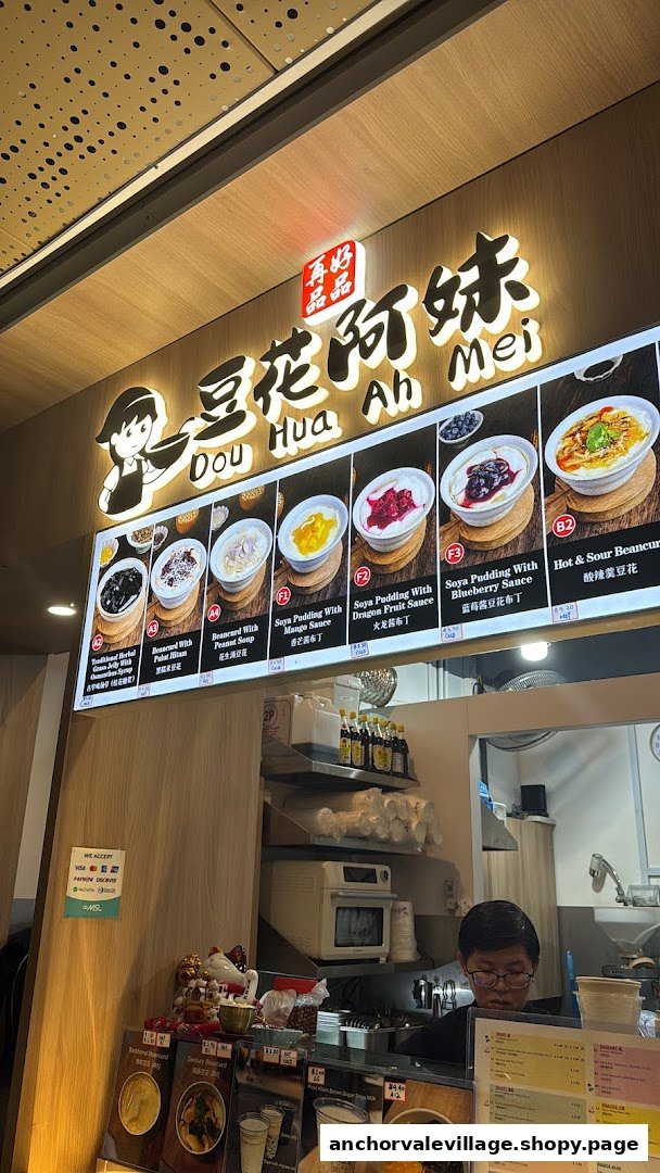 A digital menu board at Dou Hua Ah Mei showcasing various soya puddings and beancurd desserts.
