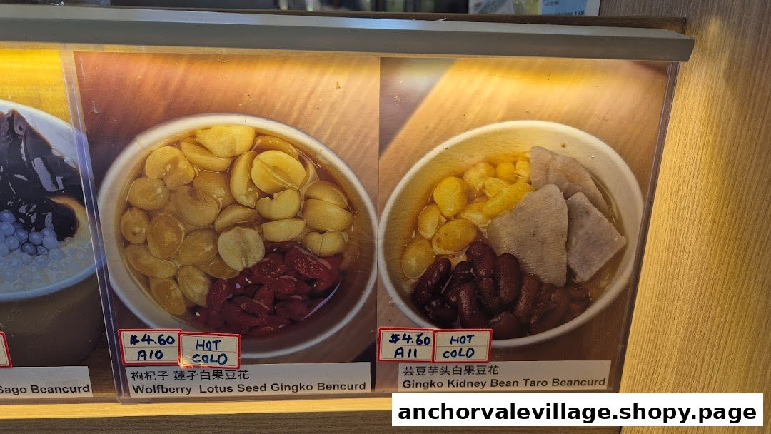Close-up of a menu display featuring two traditional beancurd desserts with ingredients and prices.