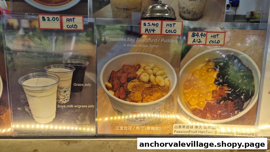 A display board showcasing various traditional Chinese desserts and drinks with prices and descriptions.