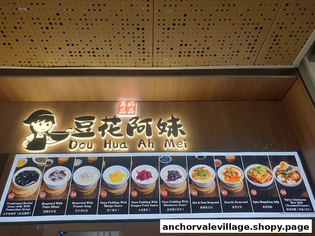 A brightly lit menu board for Dou Hua Ah Mei, showcasing various beancurd and dessert options.