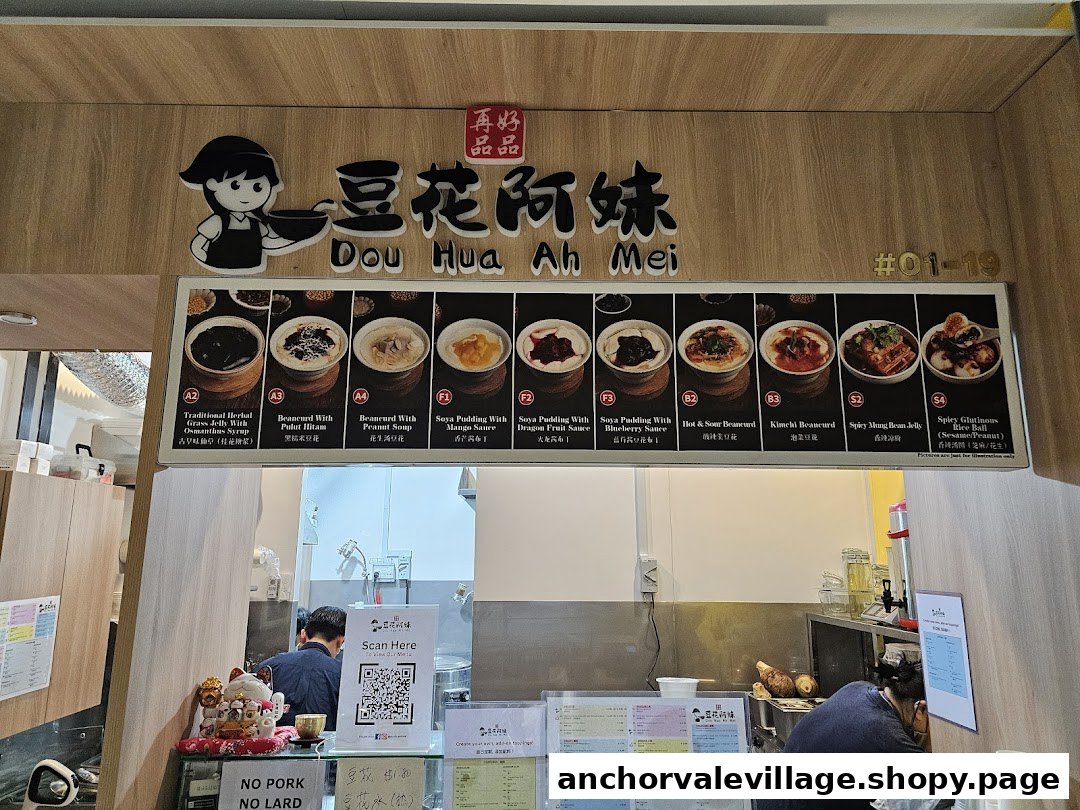 A view of Dou Hua Ah Mei's counter with a prominent menu board and staff.