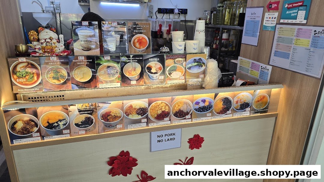 A vibrant display counter showcasing a variety of traditional Chinese desserts and beancurd dishes.