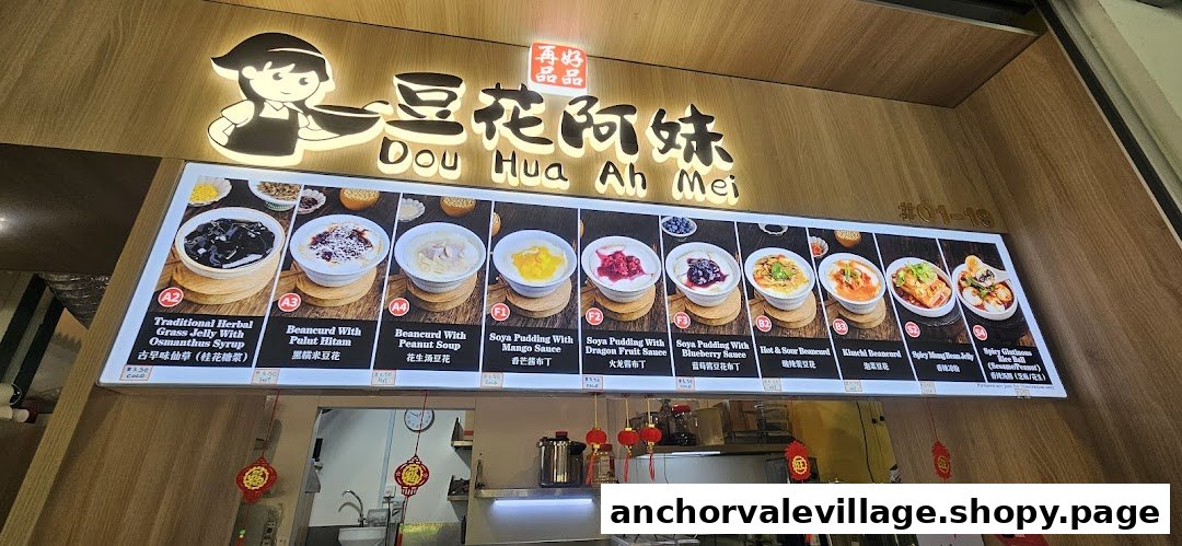 An illuminated display board showcasing various traditional and modern desserts and savory snacks.