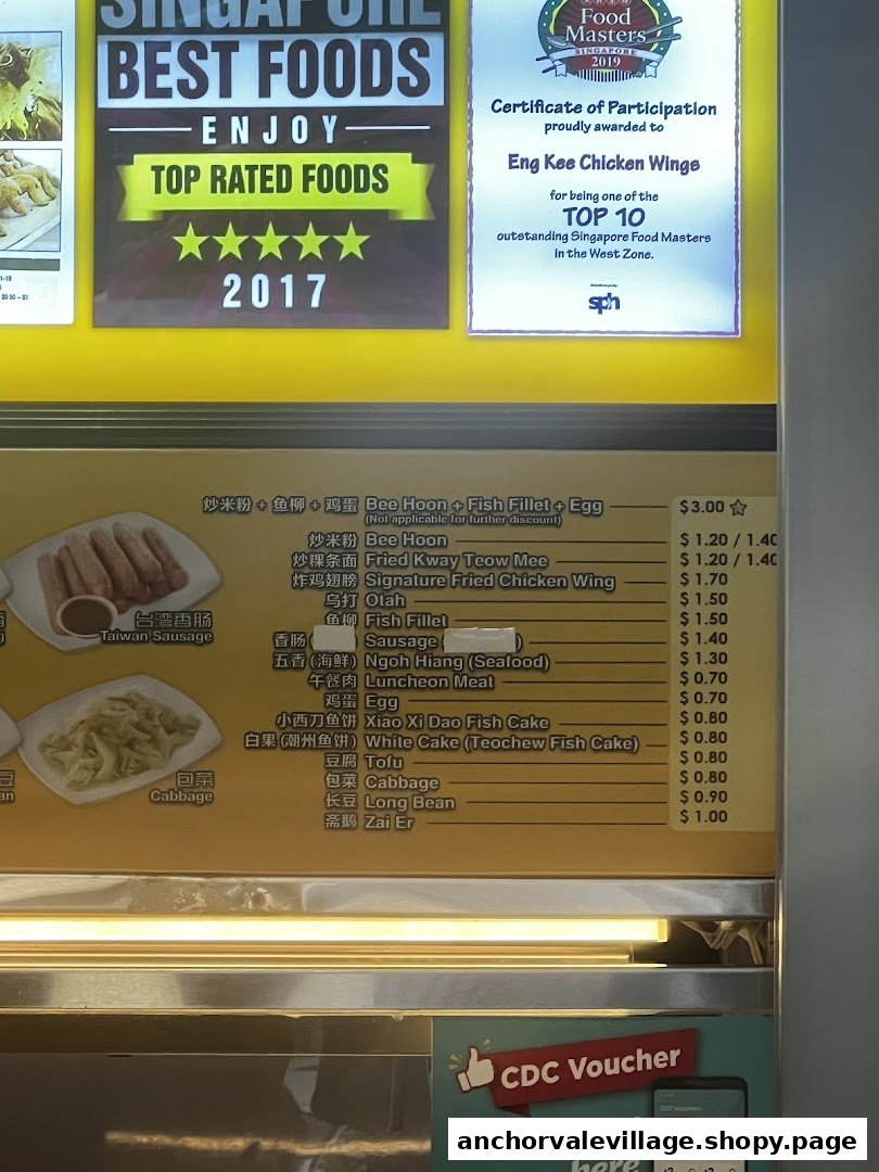 A menu board displaying food items, prices, and awards for Eng Kee Chicken Wings.