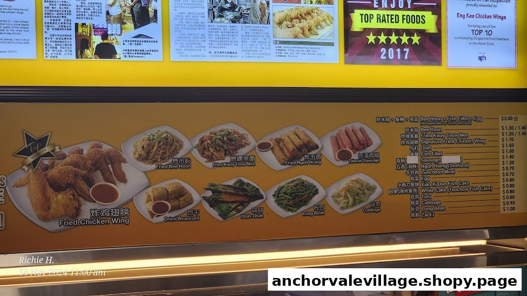 A menu board displaying various fried food items, noodles, and sides with prices.
