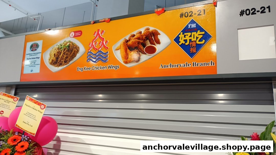 Signage for Eng Kee Chicken Wings, Anchorvale Village, featuring fried chicken wings and noodles.