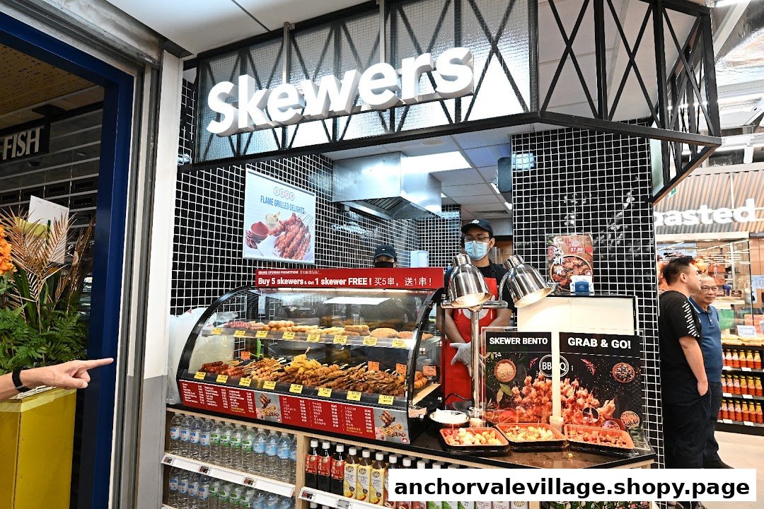 A food stall named 'Skewers' inside FairPrice Anchorvale Village, offering flame-grilled skewers and bento boxes.