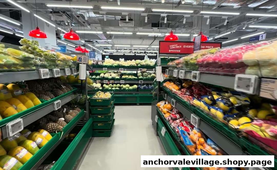 An aisle in FairPrice supermarket showcasing a wide variety of fresh fruits and vegetables.