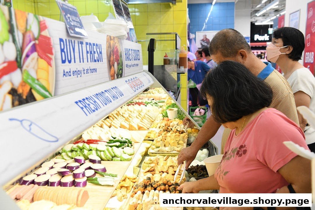 Customers select fresh Yong Tau Foo ingredients from a well-stocked display at FairPrice.