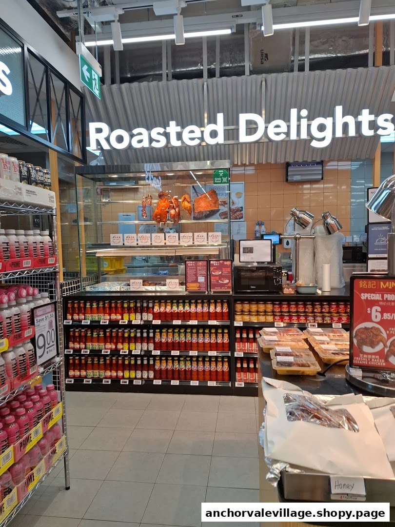 An interior view of a supermarket's 'Roasted Delights' section, featuring roasted meats, sauces, and prepared foods.