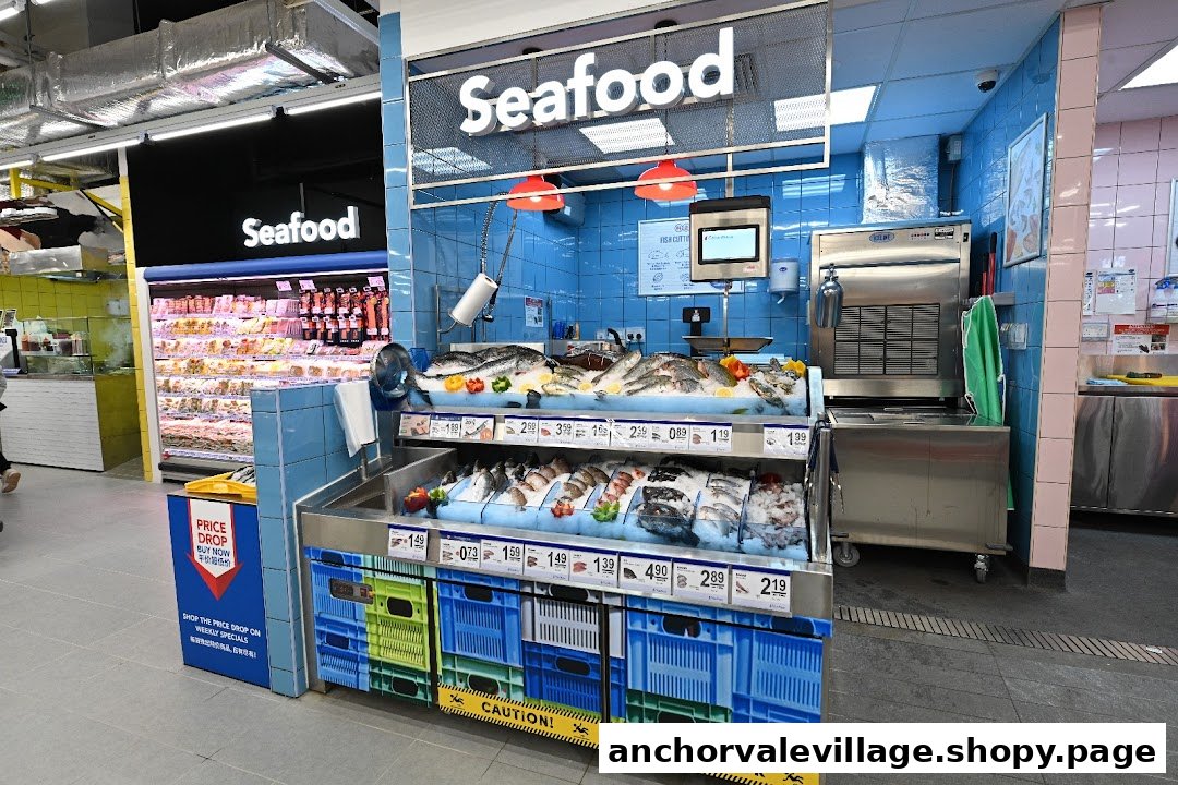 A vibrant fresh seafood counter with various fish and shellfish on ice at FairPrice supermarket.