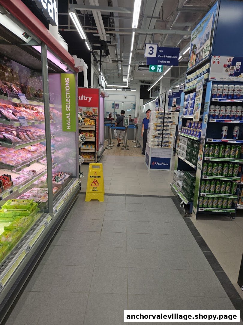 An aisle in FairPrice supermarket featuring fresh produce, packaged goods, and a 'wet floor' sign.