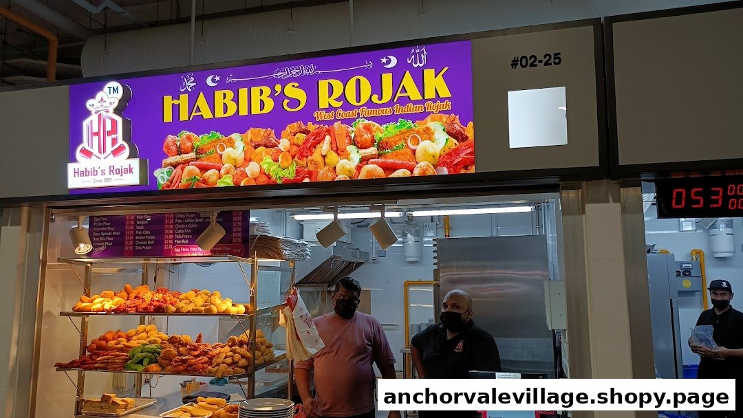 A vibrant image of Habib's Rojak stall, showcasing its menu and delicious fried items.