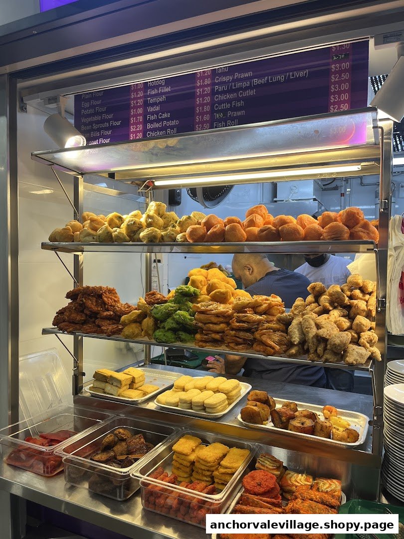 A vibrant display of fried snacks and a detailed menu board at Habibs Rojak.