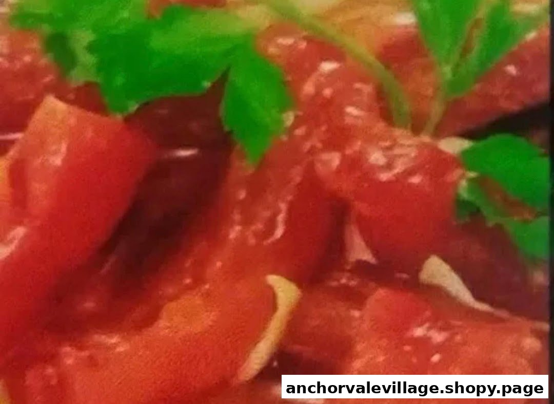 Close-up of vibrant red diced ingredients with fresh green herbs, possibly tomatoes and parsley.