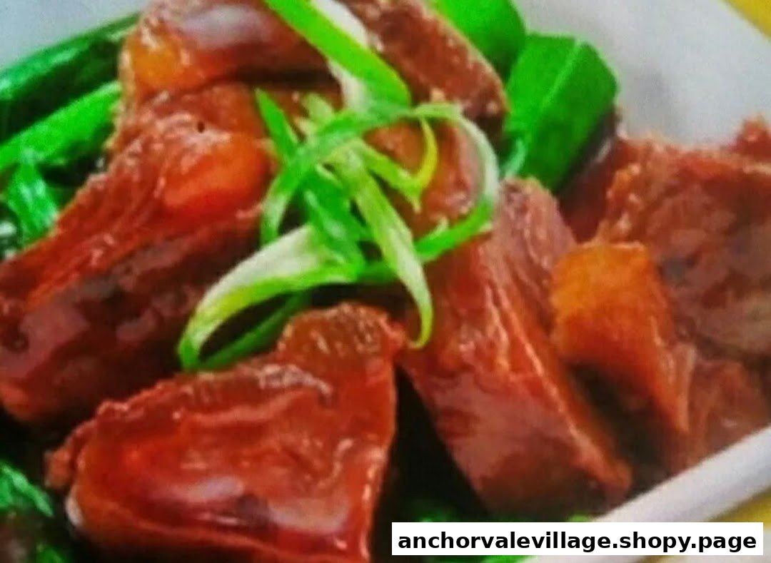 Close-up of tender braised beef or pork with green onions and vegetables.