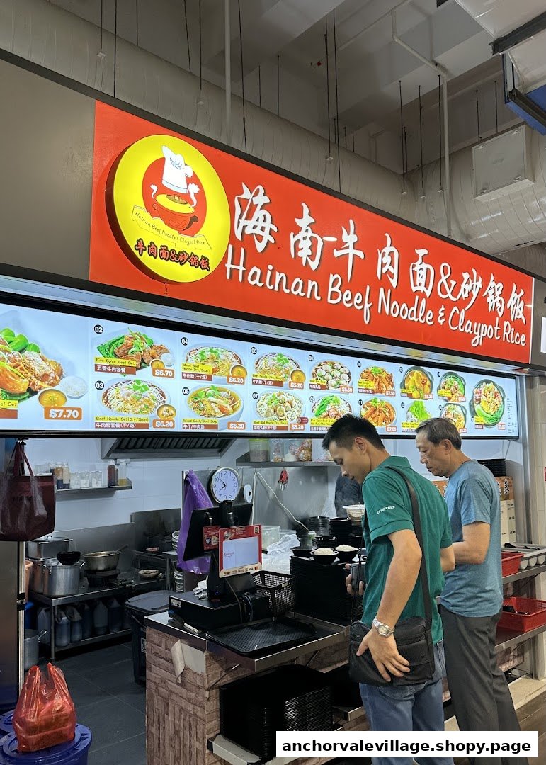 A vibrant menu board showcasing various beef noodle and claypot rice dishes at Hainan Beef Noodle & Claypot Rice.