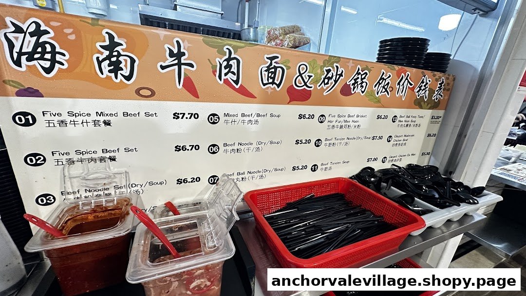 A detailed menu board displaying various beef noodle and claypot rice dishes with prices.