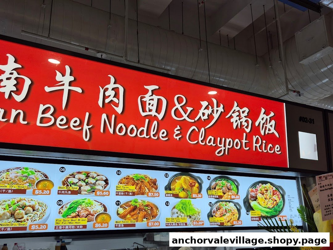 An illuminated menu board displaying various beef noodle and claypot rice dishes with prices.