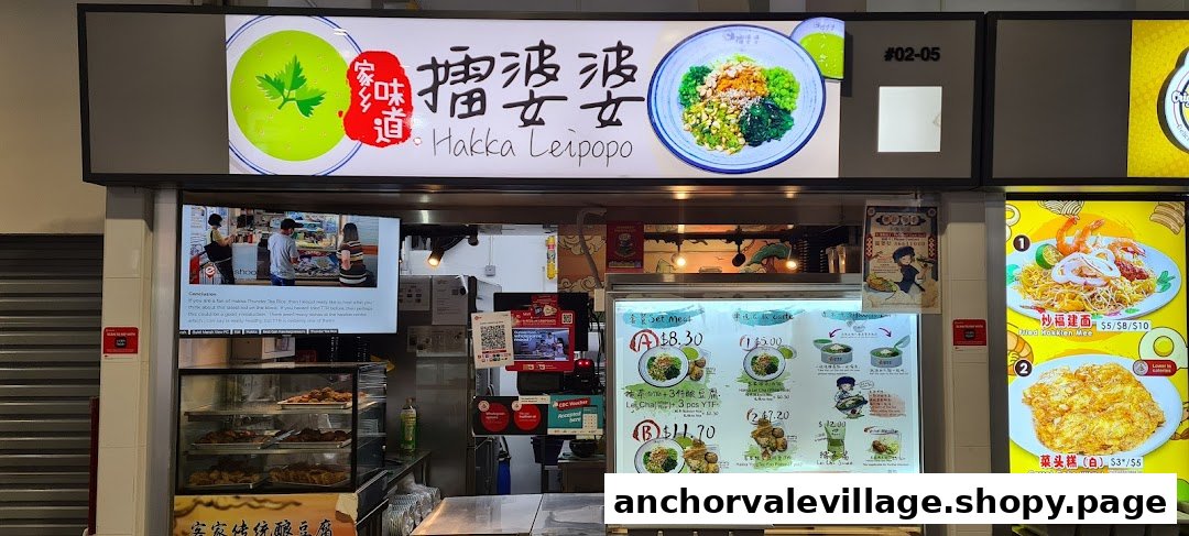 The shop front of Hakka Leipopo, featuring their menu boards with traditional Hakka dishes and prices.