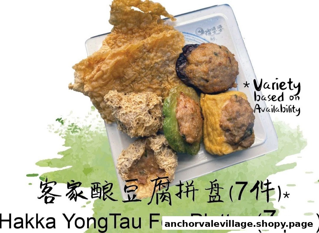 A platter of assorted Hakka Yong Tau Foo pieces, including stuffed tofu, bitter gourd, and fried items.