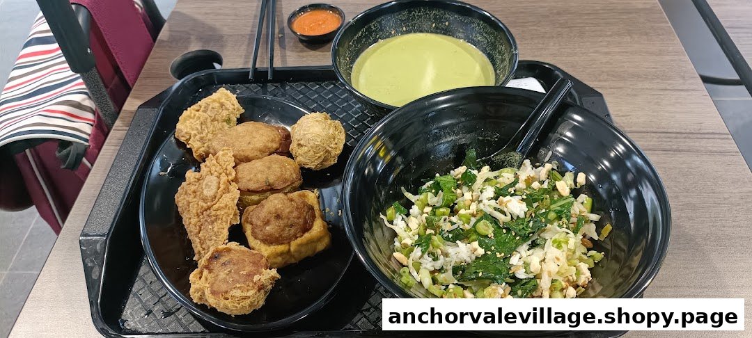 A delicious spread of Hakka Lei Cha (Thunder Tea Rice) with assorted Yong Tau Foo items on a table.