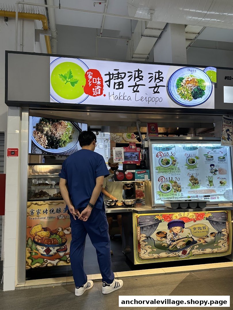 A customer stands at the counter of Hakka Leipopo, a shop specializing in traditional Hakka cuisine.