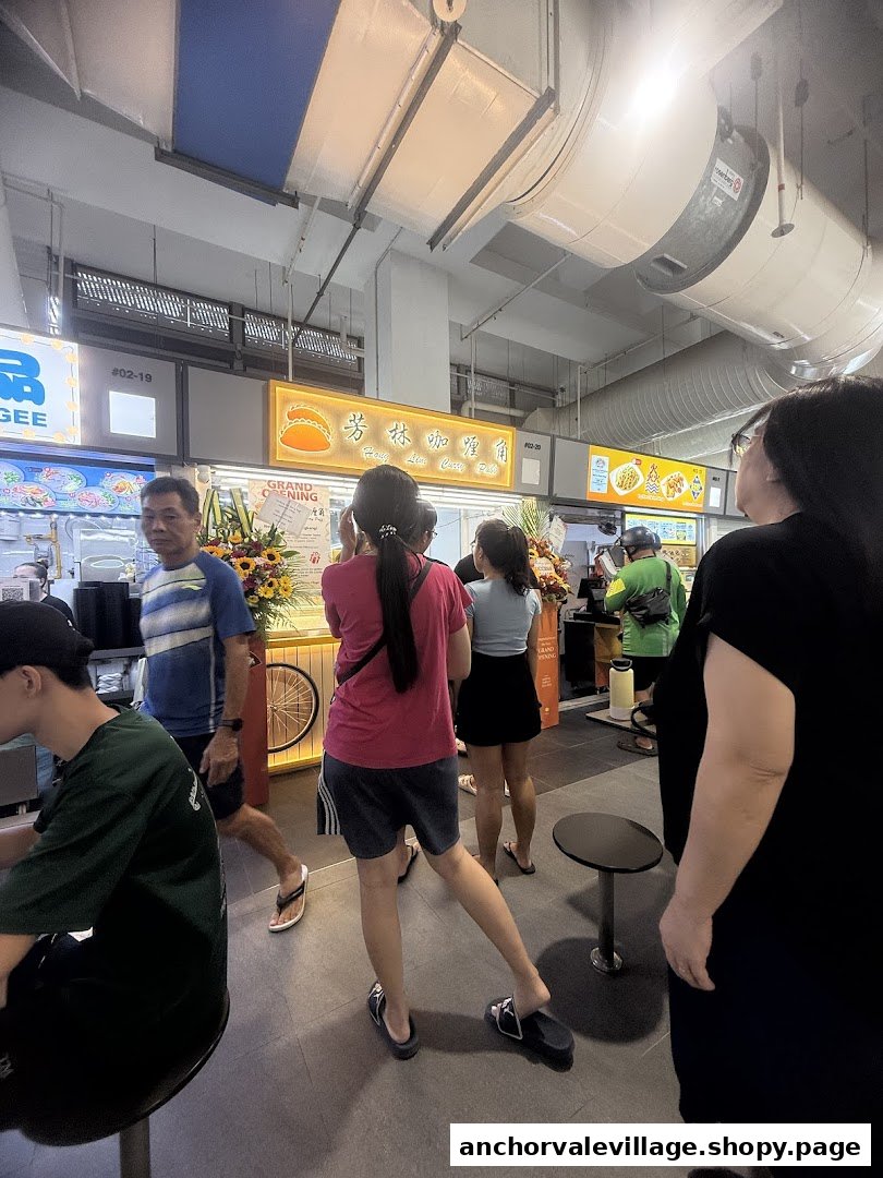 The Hong Lim Curry Puff stall, featuring a 'Grand Opening' sign, with customers and staff present.