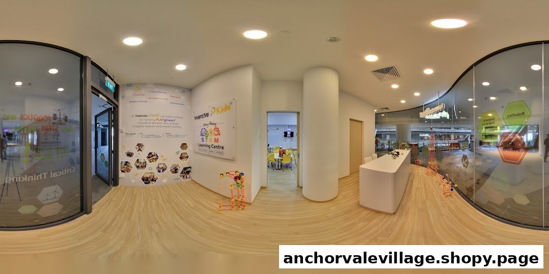 Interior view of a kids' play-based STEM learning centre with interactive displays and classrooms.