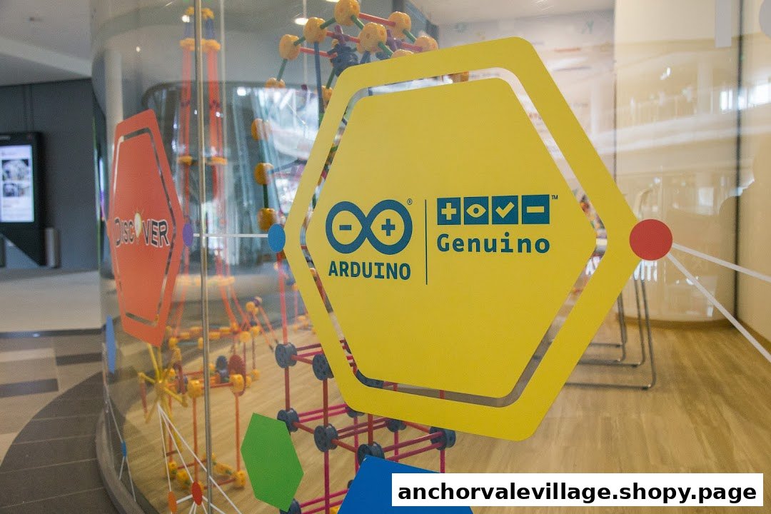 Close-up of the glass entrance to a STEM learning center, featuring Arduino and Genuino branding.