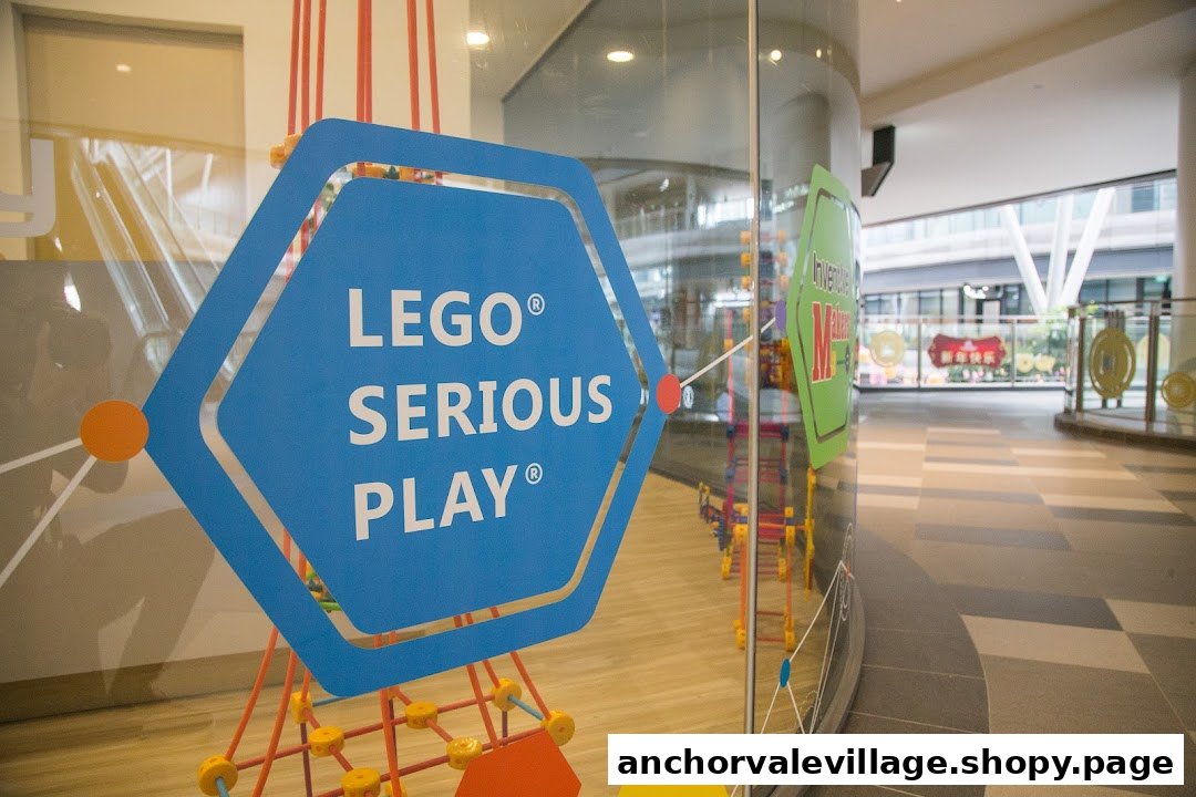A glass wall of a kids' learning center featuring 'LEGO Serious Play' branding and visible play structures inside.