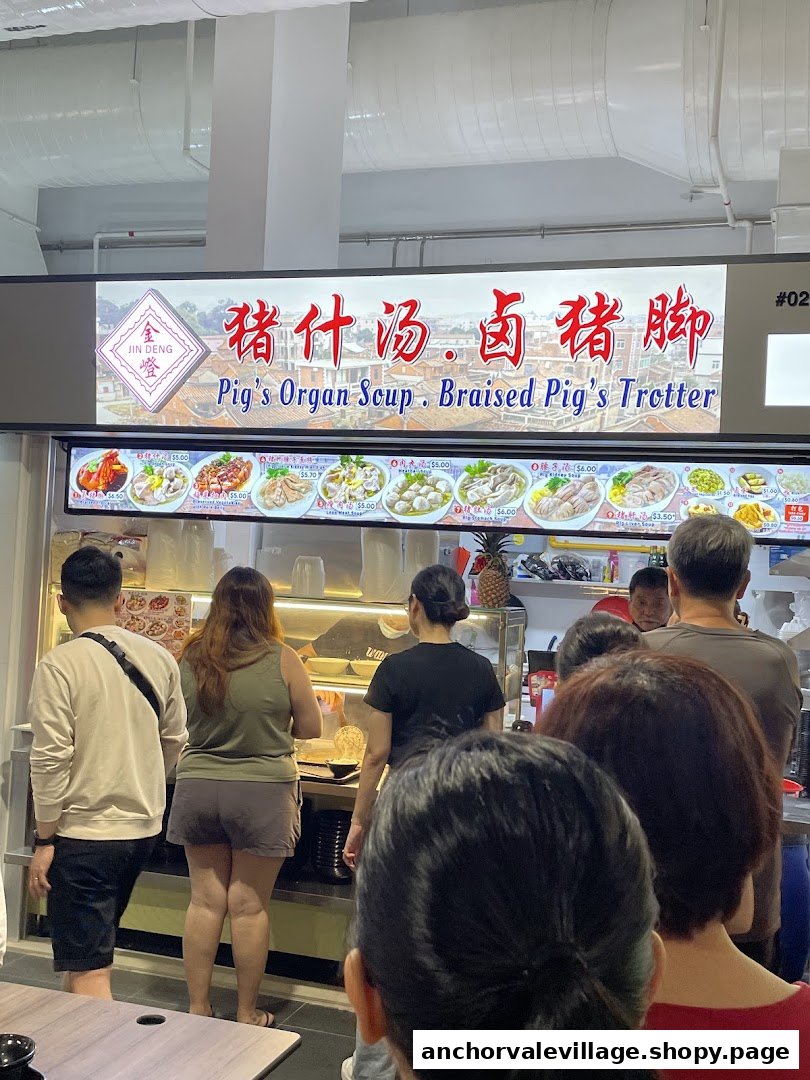 A food stall display featuring various pig organ soup and braised pig trotter dishes with prices, and customers queuing.
