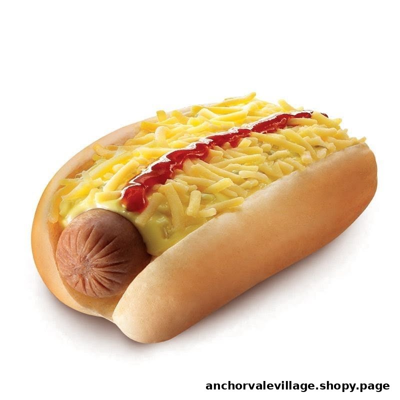 A delicious hotdog topped with shredded cheese and ketchup on a white background.