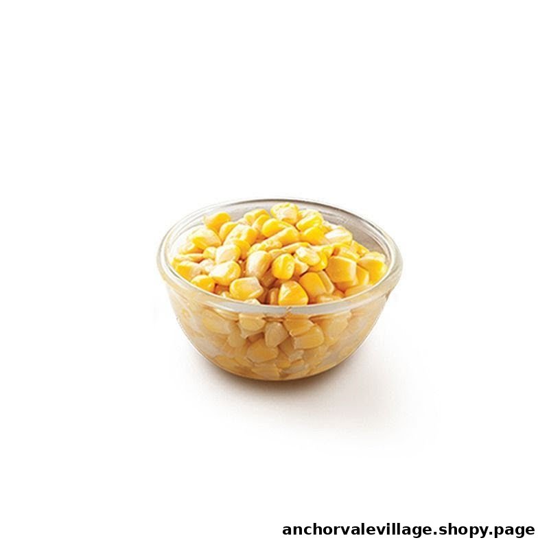 A clear glass bowl filled with bright yellow corn kernels, isolated on a white background.