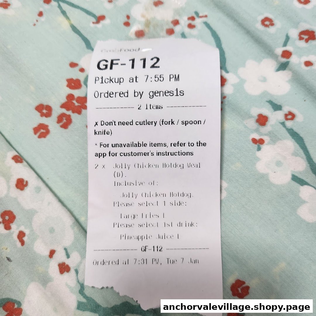 A GrabFood order slip for Jollibee's Jolly Chicken Hotdog Meal, detailing pickup and items.