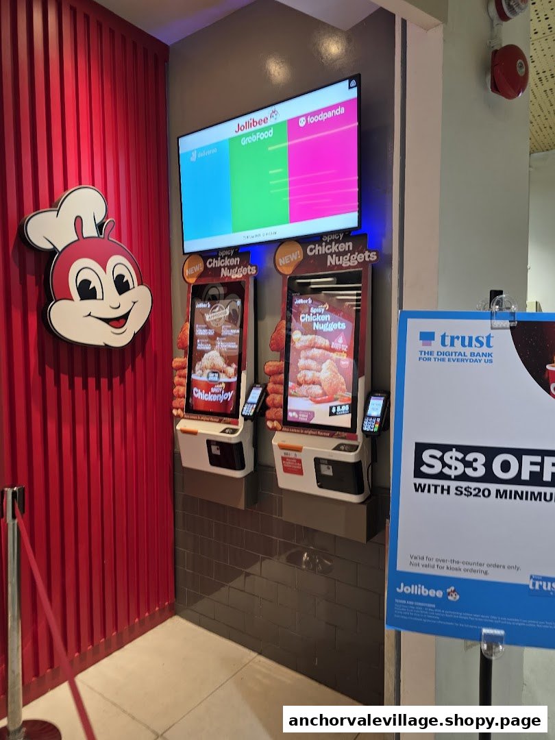 Jollibee's self-ordering kiosks, digital display, and promotional offer for a convenient dining experience.