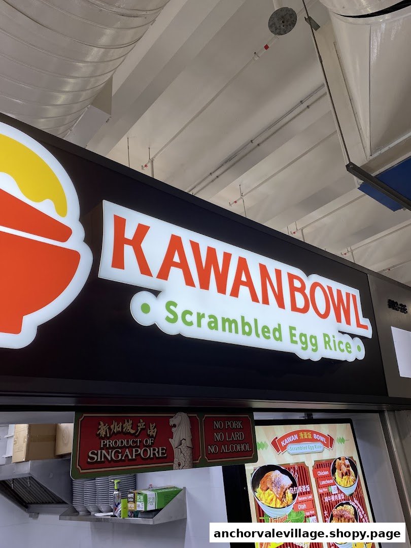 A close-up of the Kawan Bowl Scrambled Egg Rice stall signage and a partial view of their menu board.