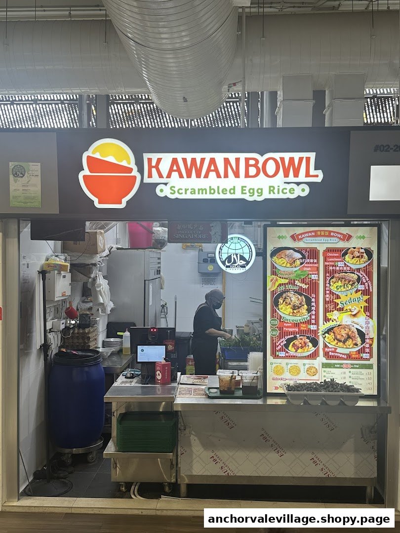 The storefront of Kawan Bowl Scrambled Egg Rice, featuring its logo, menu display, and a staff member.