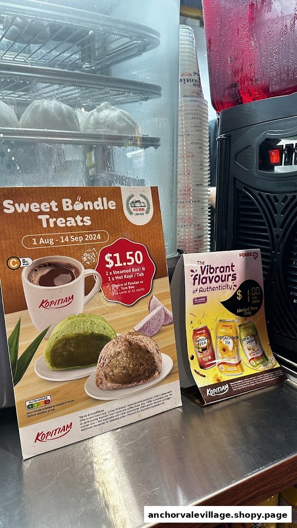 Promotional displays for steamed buns, hot drinks, and bottled beverages at Kopi Kiosk.
