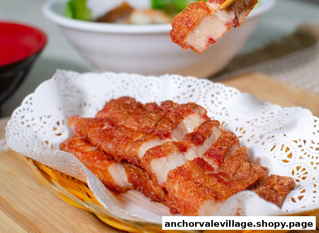 Close-up of crispy fried pork belly slices served in a basket, with chopsticks holding a piece.