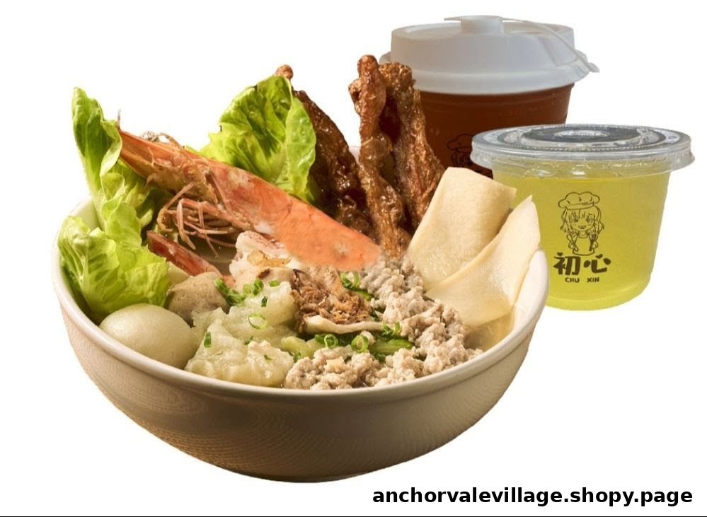 A hearty bowl of soup noodles with shrimp, minced meat, fish cakes, and vegetables, served with two beverages.