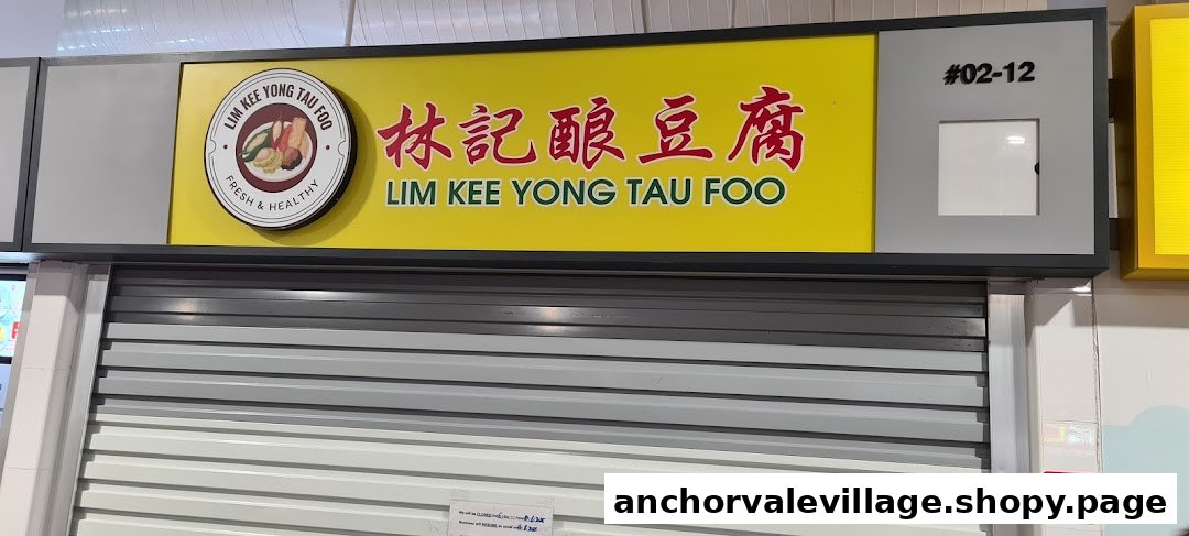 The exterior of Lim Kee Yong Tau Foo, featuring its vibrant yellow signboard and closed shutter.