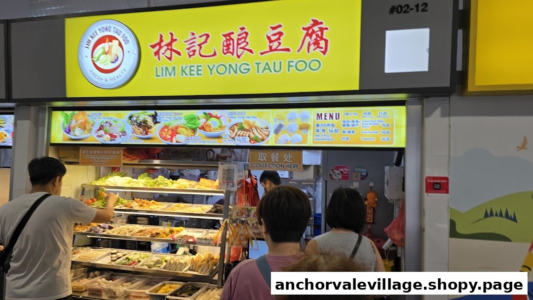 Customers select fresh ingredients at the Lim Kee Yong Tau Foo stall in a bustling hawker center.