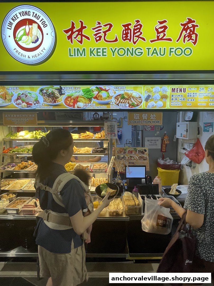 Customers order fresh Yong Tau Foo at Lim Kee's vibrant counter, showcasing various ingredients and menu options.