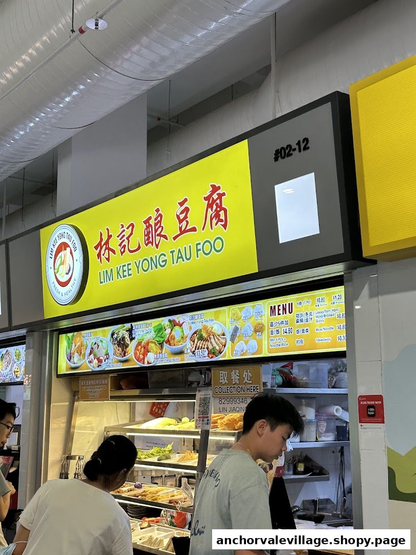 A vibrant menu board and counter of Lim Kee Yong Tau Foo, showcasing fresh ingredients and pricing.