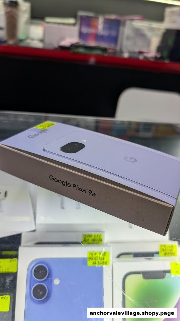 A Google Pixel 9a phone box displayed with other smartphone boxes in a retail shop.