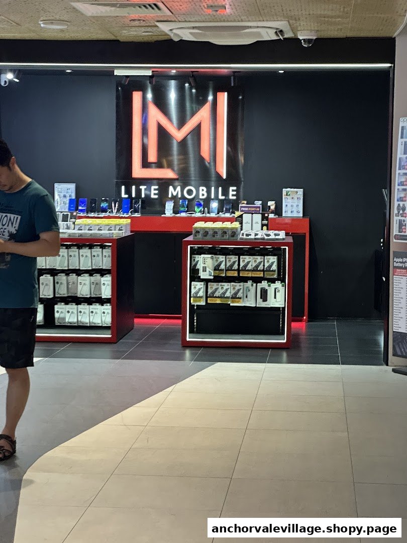 Interior view of Lite Mobile, showcasing mobile phones, accessories, and display cases with a customer browsing.